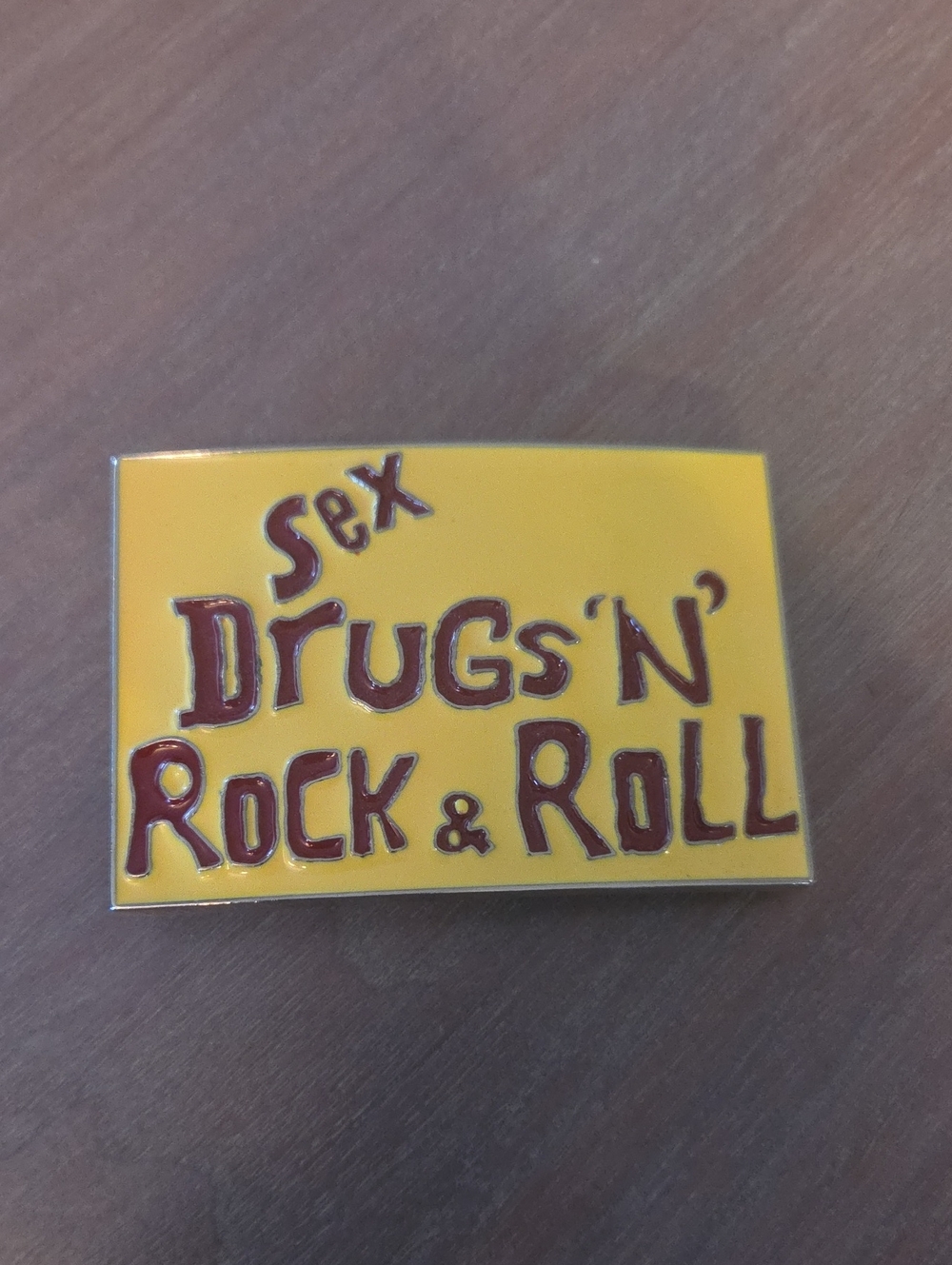Sex Drugs 'N' Rock & Roll" novelty enamel belt buckle.